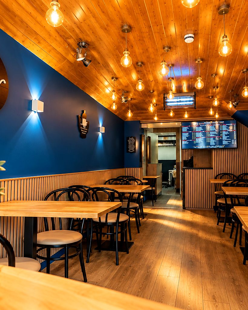 The City Grill dining room with blue walls and warm lights
